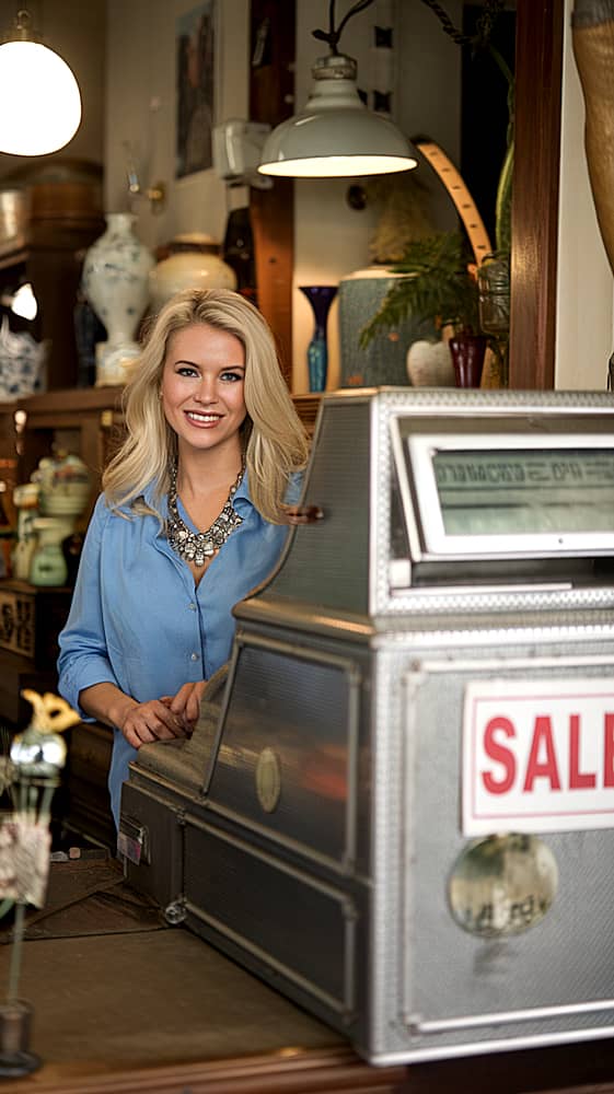 McKinney shop owner at cash register